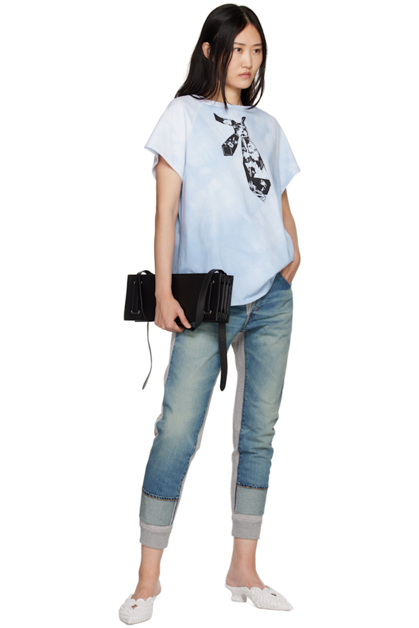 Hand-dyed cotton jersey T-shirt.

· Boat neck
· Graphic screen printed at front
· Shirttail hem
· Raglan sleeves

Supplier color: Tie/Blue soft dye