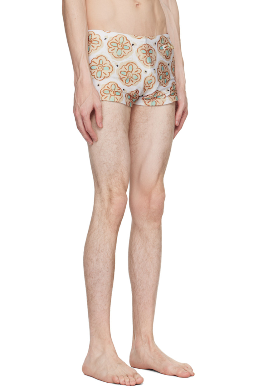 Stretch recycled polyester jersey swim briefs. Graphic pattern printed throughout.

· Concealed drawstring at waistband
· Single-pocket styling
· Full jersey lining

Supplier color: Beige/Pistachio