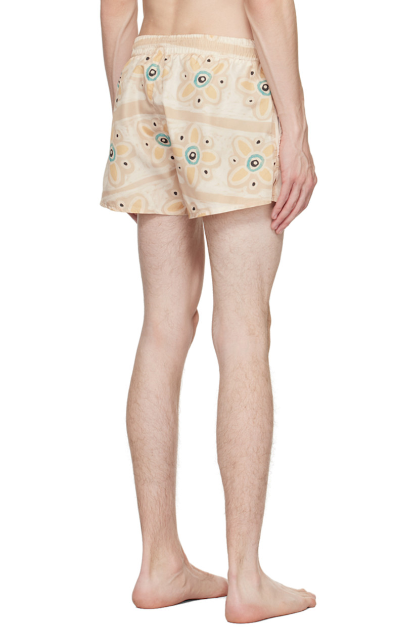 Quick-dry nylon taffeta swim shorts. Graphic pattern printed throughout.

· Drawstring at elasticized waistband
· Two-pocket styling
· Vented outseams
· Partial mesh lining

Supplier color: Beige/Blue