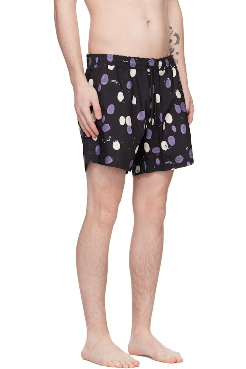 Nylon twill swim shorts. Polka dot pattern printed throughout.

· Drawstring at elasticized waistband
· Three-pocket styling
· Vented side seams
· Partial mesh lining

Supplier color: Black