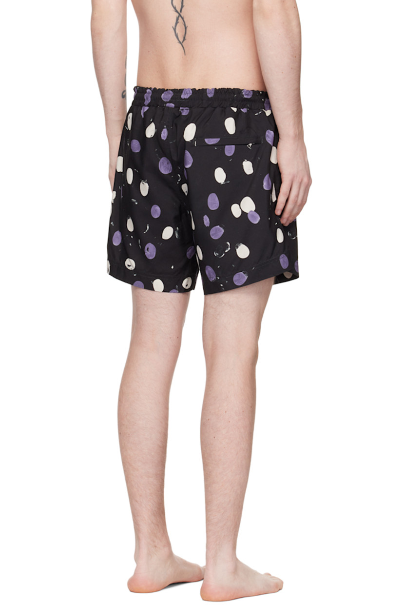 Nylon twill swim shorts. Polka dot pattern printed throughout.

· Drawstring at elasticized waistband
· Three-pocket styling
· Vented side seams
· Partial mesh lining

Supplier color: Black