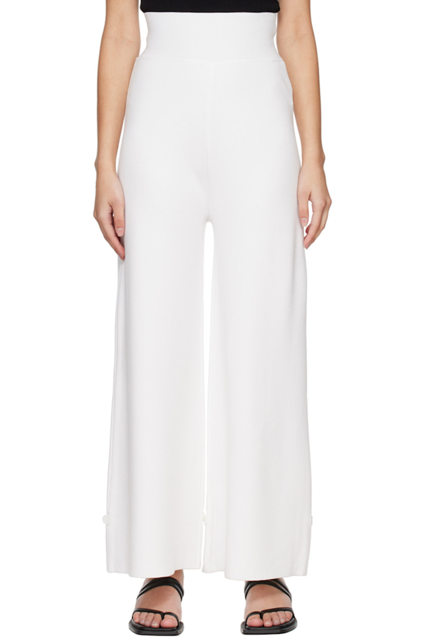 Knit rayon-blend lounge pants.

· Elasticized waistband
· Button accent at cuffs

Supplier color: White