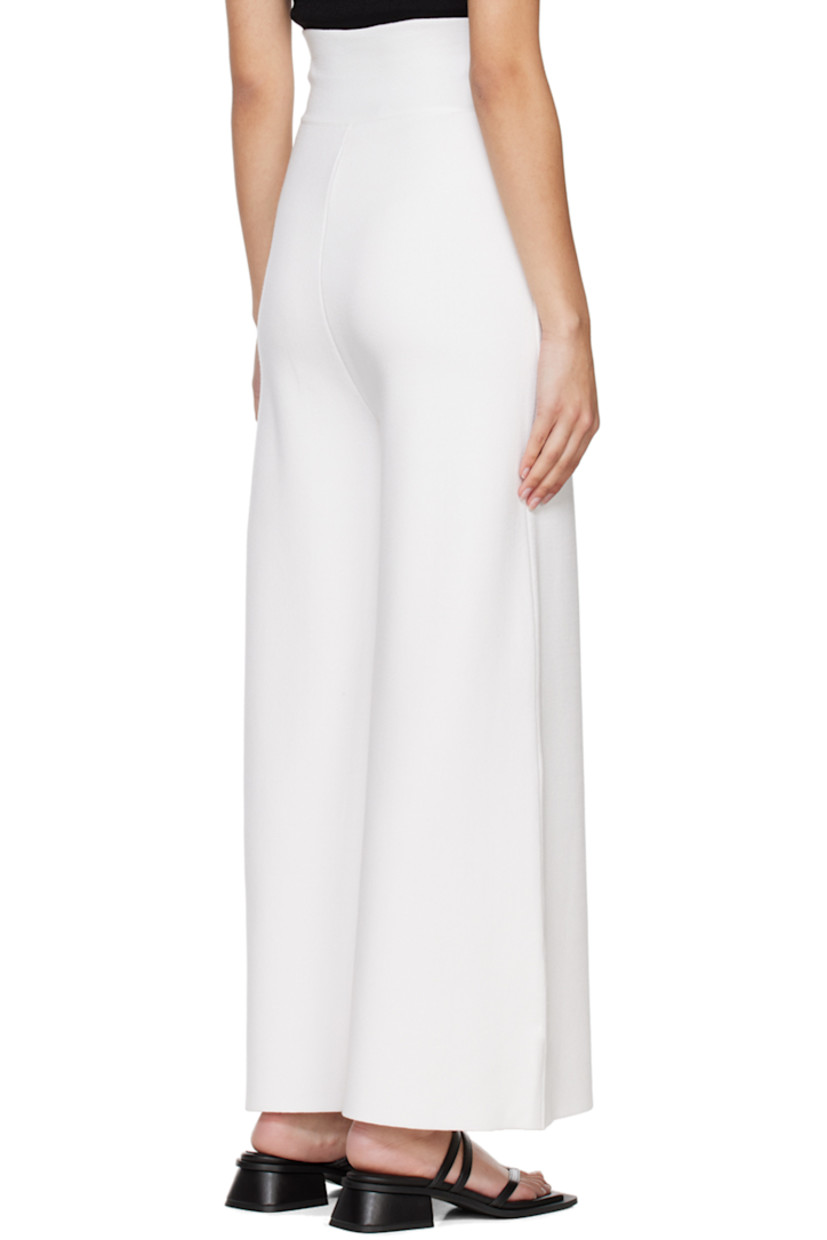 Knit rayon-blend lounge pants.

· Elasticized waistband
· Button accent at cuffs

Supplier color: White
