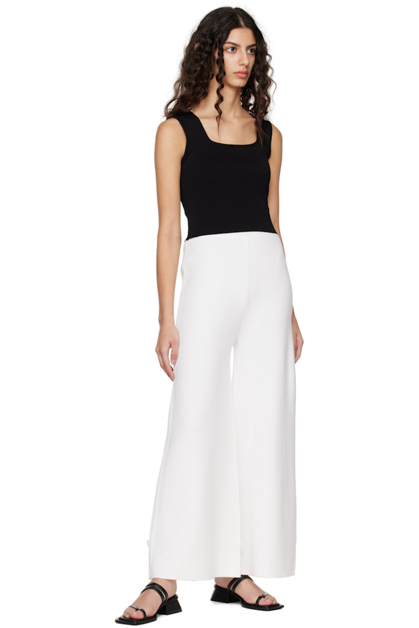Knit rayon-blend lounge pants.

· Elasticized waistband
· Button accent at cuffs

Supplier color: White