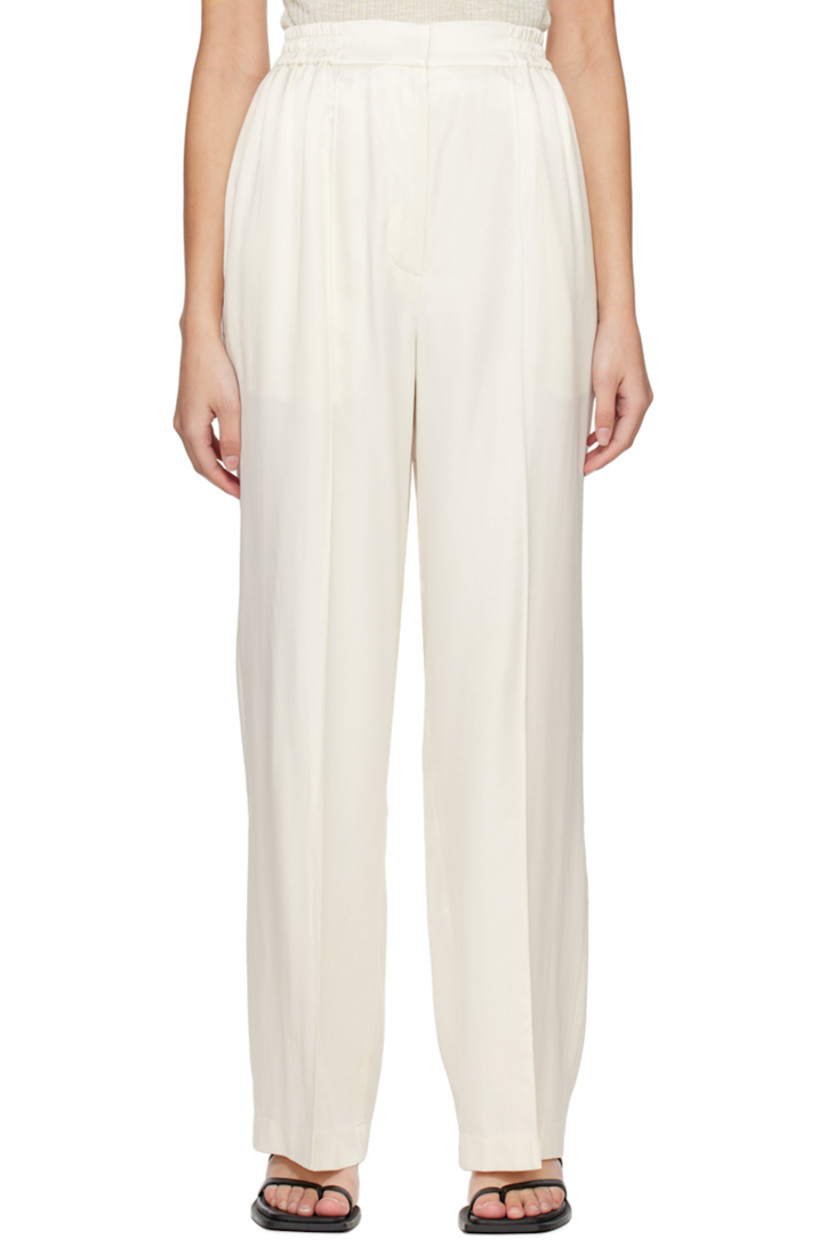 Rayon-blend satin trousers.

· Elasticized waistband
· Two-pocket styling
· Zip-fly
· Pinched seams at front legs

Supplier color: Cream