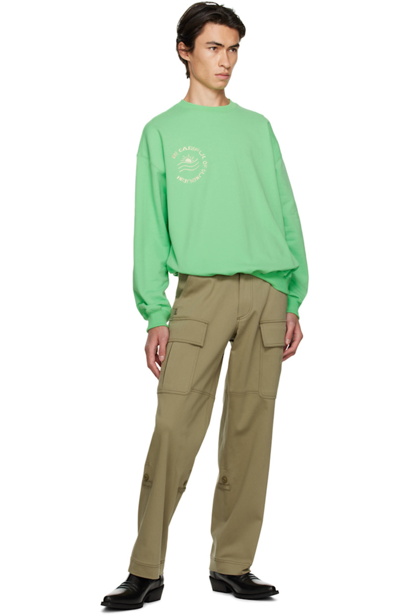 Stretch rayon and cotton-blend jersey cargo pants.

· Belt loops
· Four-pocket styling
· Zip-fly
· Silver-tone logo hardware at front
· Concealed button tabs at cuffs for alternate styling
· Bellows pockets at outseams
· Contrast stitching

Available exclusively at SSENSE.

Supplier color: Khaki