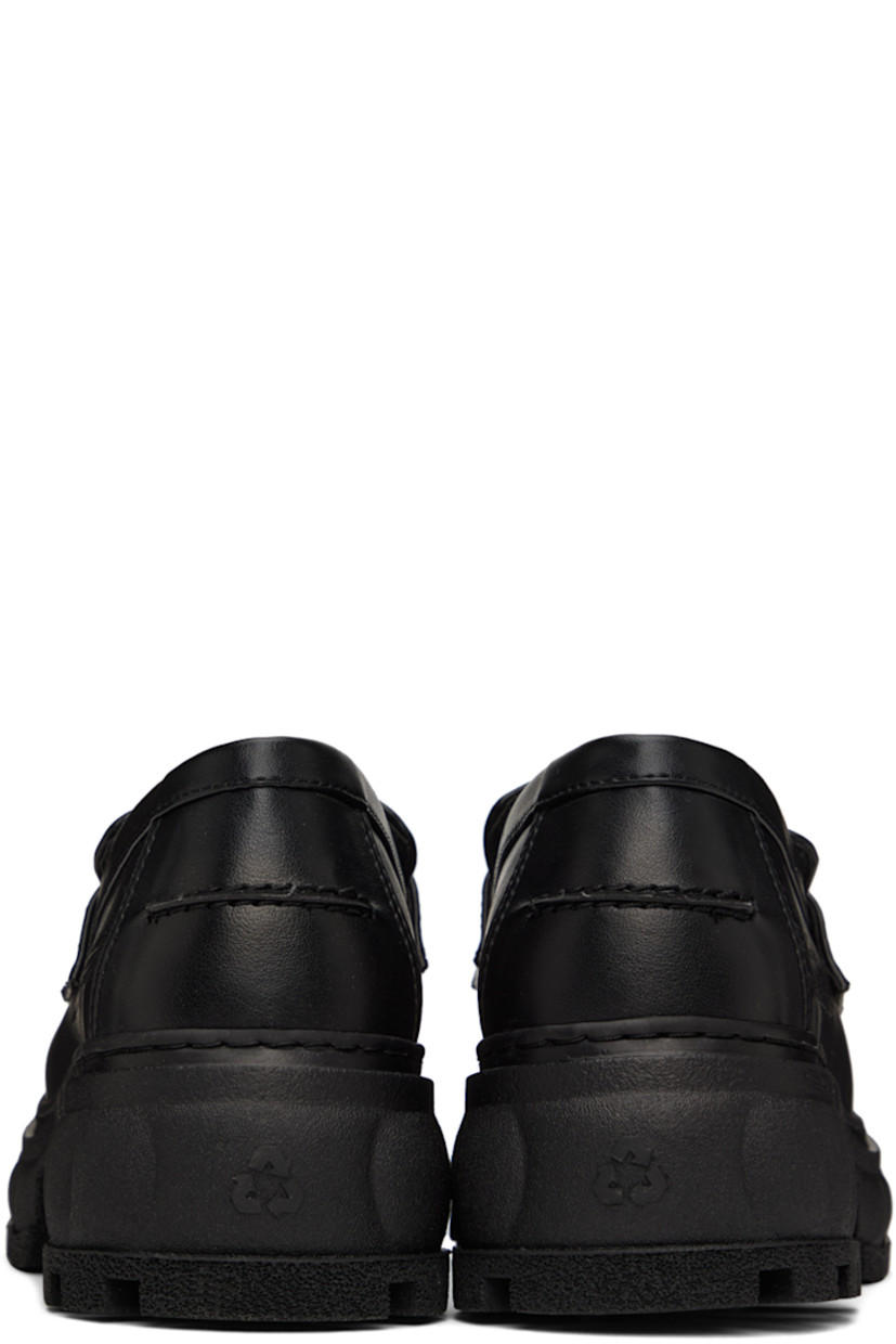 Handcrafted PETA-certified buffed AppleSkin™️ faux-leather loafers in black. Logo-embossed strap at vamp. 

· Round moc toe
· Text embossed at outer side
· Logo printed at padded footbed
· Textured rubber platform midsole
· Treaded rubber outsole
· Platform: H1.5 in 
· Heel: H2.5 in 

Supplier color: Black