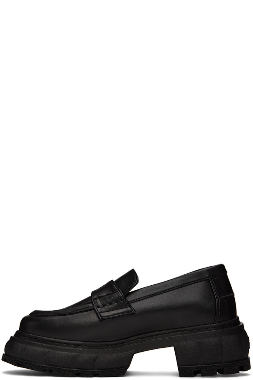 Handcrafted PETA-certified buffed AppleSkin™️ faux-leather loafers in black. Logo-embossed strap at vamp. 

· Round moc toe
· Text embossed at outer side
· Logo printed at padded footbed
· Textured rubber platform midsole
· Treaded rubber outsole
· Platform: H1.5 in 
· Heel: H2.5 in 

Supplier color: Black