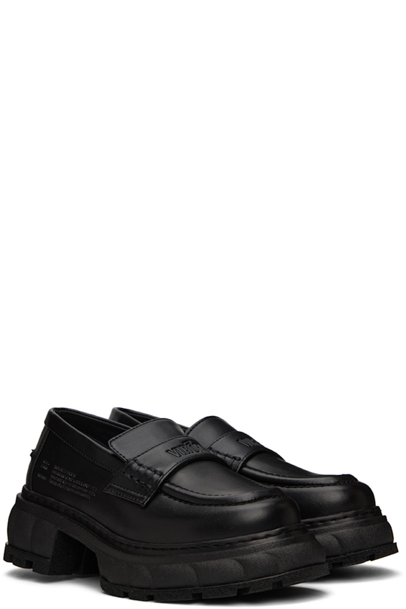 Handcrafted PETA-certified buffed AppleSkin™️ faux-leather loafers in black. Logo-embossed strap at vamp. 

· Round moc toe
· Text embossed at outer side
· Logo printed at padded footbed
· Textured rubber platform midsole
· Treaded rubber outsole
· Platform: H1.5 in 
· Heel: H2.5 in 

Supplier color: Black