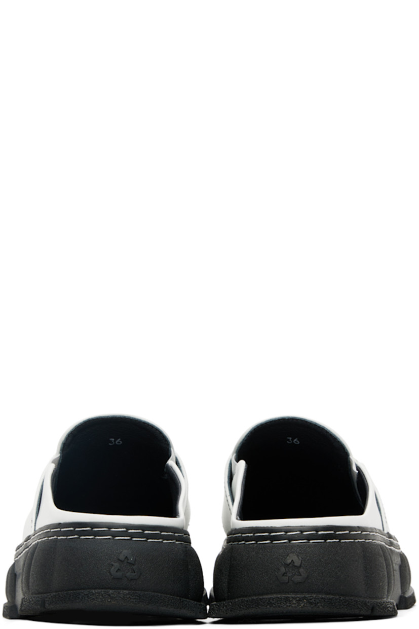 PETA-certified buffed Appleskin™ faux-leather slip-on loafers in white. 

· Round moc toe
· Strap with cut-out at vamp
· Logo printed at vamp and padded footbed
· Elasticized gusset at sides
· Sculptural rubber platform midsole
· Treaded rubber outsole
· Platform: H1.5 in

Supplier color: Contrast