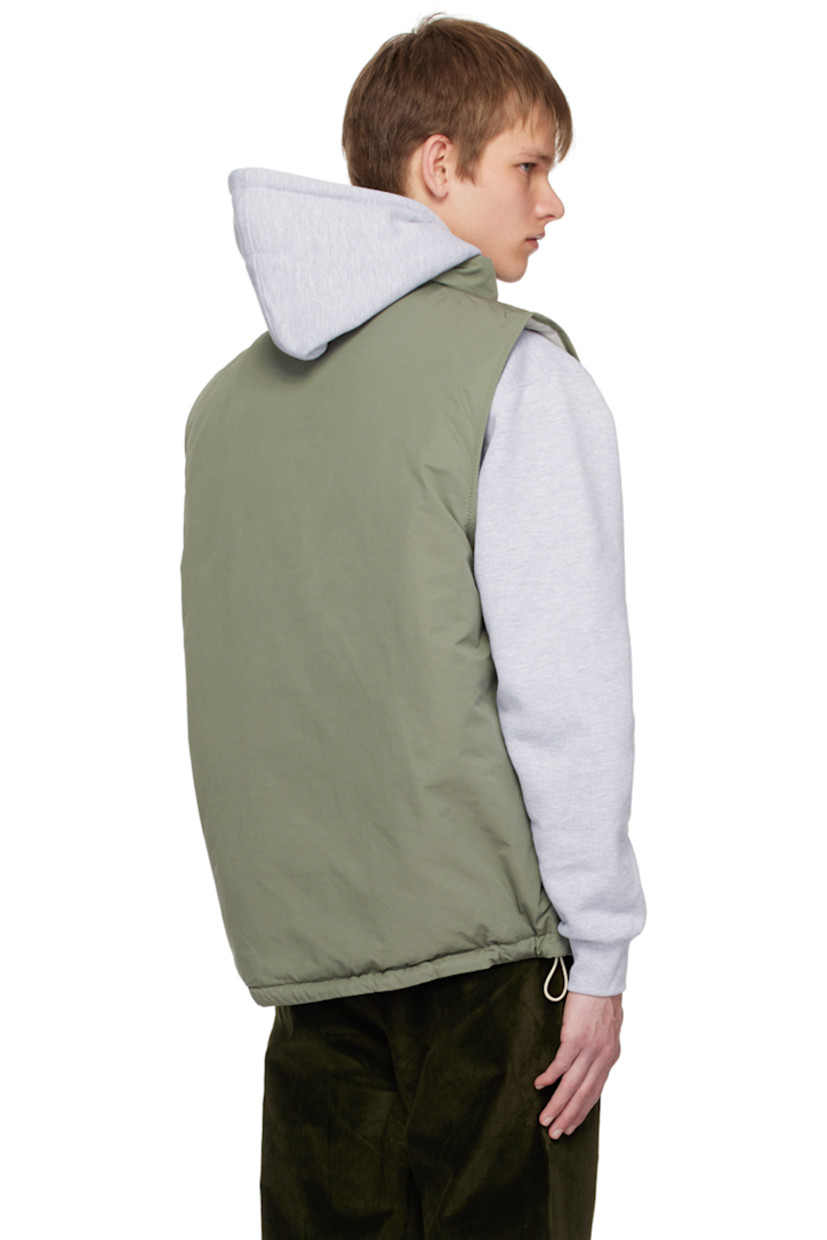 Insulated cotton and nylone-blend faille vest. 

· Funnel neck
· Zip closure
· Patch pocket with concealed zip closure
· Rubberized logo patch at front
· Zip pockets at waist
· Bungee-style drawstring at hem
· Logo flag at side seam
· Patch pocket at interior
· Full ripstop lining

Supplier color: Dusty sage