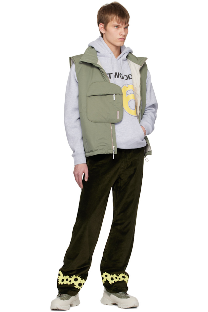 Insulated cotton and nylone-blend faille vest. 

· Funnel neck
· Zip closure
· Patch pocket with concealed zip closure
· Rubberized logo patch at front
· Zip pockets at waist
· Bungee-style drawstring at hem
· Logo flag at side seam
· Patch pocket at interior
· Full ripstop lining

Supplier color: Dusty sage