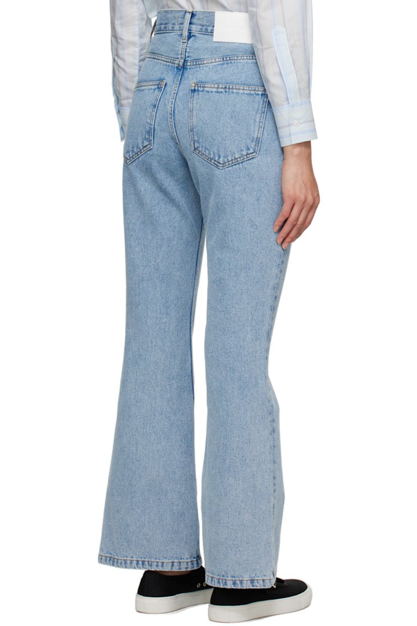Non-stretch organic cotton denim jeans. Fading throughout. 

· Belt loops 
· Five-pocket styling 
· Zip-fly
· Leather logo patch at back waistband 
· Contrast stitching in brown

Supplier color: Light blue