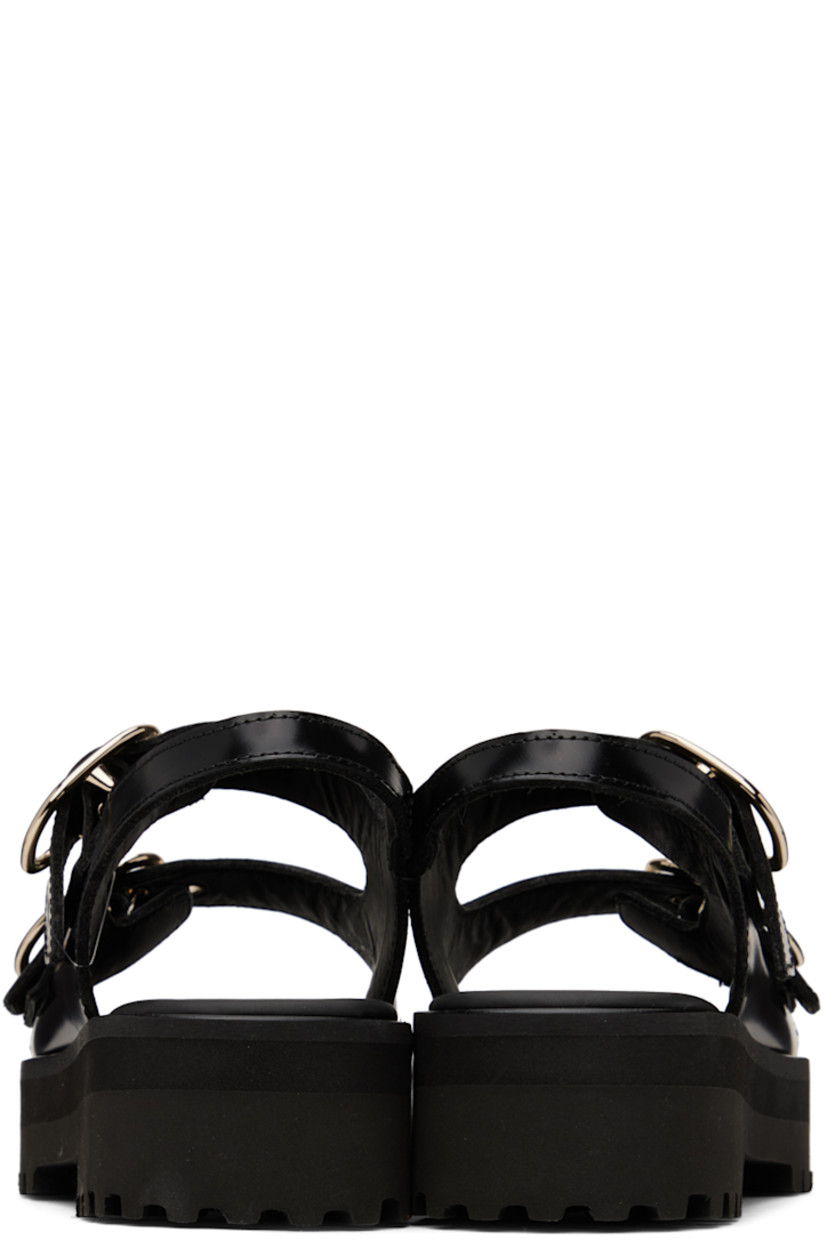Polished calfskin sandals in black.

· Open round toe
· Adjustable pin-buckle straps at vamp
· Fixed slingback strap
· Padded leather footbed
· Platform foam rubber midsole
· Treaded foam rubber outsole
· Platform: H1.5 in

Supplier color: Black
