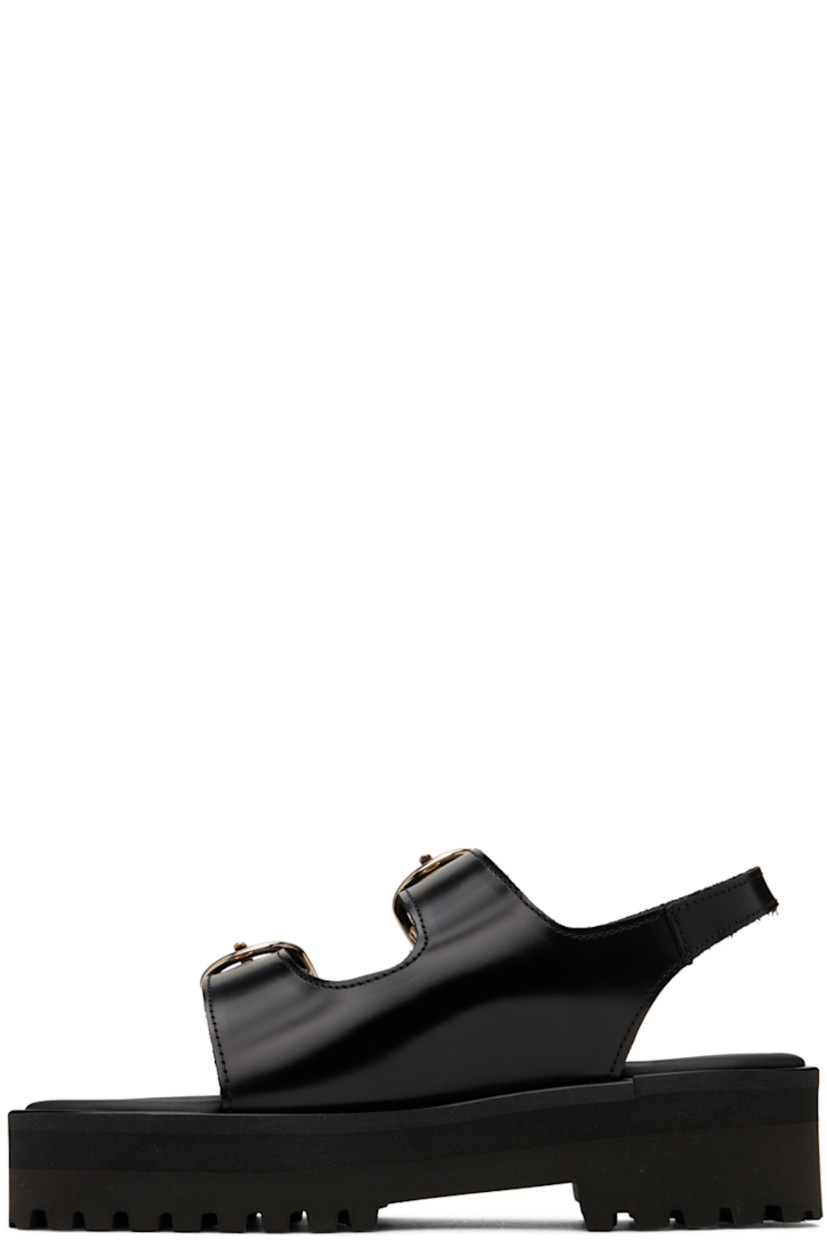 Polished calfskin sandals in black.

· Open round toe
· Adjustable pin-buckle straps at vamp
· Fixed slingback strap
· Padded leather footbed
· Platform foam rubber midsole
· Treaded foam rubber outsole
· Platform: H1.5 in

Supplier color: Black