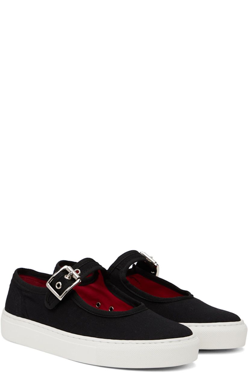 Low-top cotton twill sneakers in black.

· Round toe
· Adjustable pin-buckle strap at vamp
· Eyelet vents at inner side
· Logo embossed at heel
· Textured rubber midsole
· Treaded rubber outsole

Supplier color: Black/White