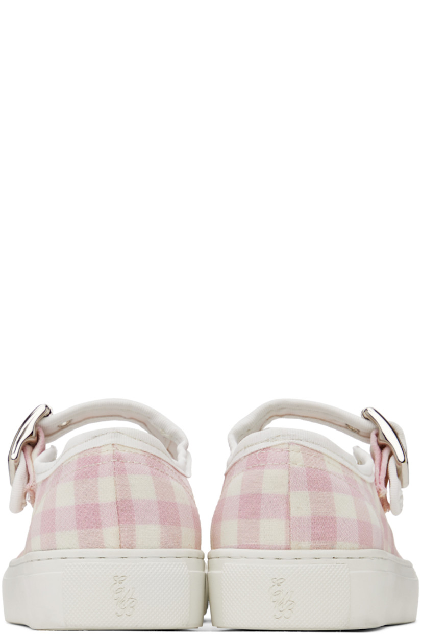 Canvas low top mary-jane style sneakers in pink. Check pattern woven throughout. 

· Pin buckle strap at vamp
· Eyelet vents at side
· Gold-tone logo stamped at padded footbed
· Rubberized logo patch at heel
· Textured rubber midsole
· Treaded rubber outsole

Supplier color: Pink check