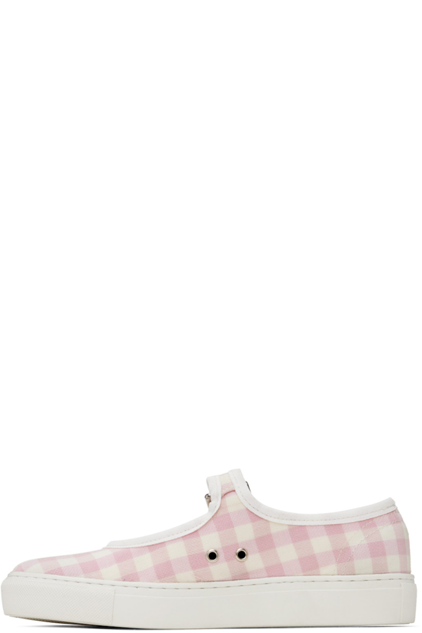 Canvas low top mary-jane style sneakers in pink. Check pattern woven throughout. 

· Pin buckle strap at vamp
· Eyelet vents at side
· Gold-tone logo stamped at padded footbed
· Rubberized logo patch at heel
· Textured rubber midsole
· Treaded rubber outsole

Supplier color: Pink check