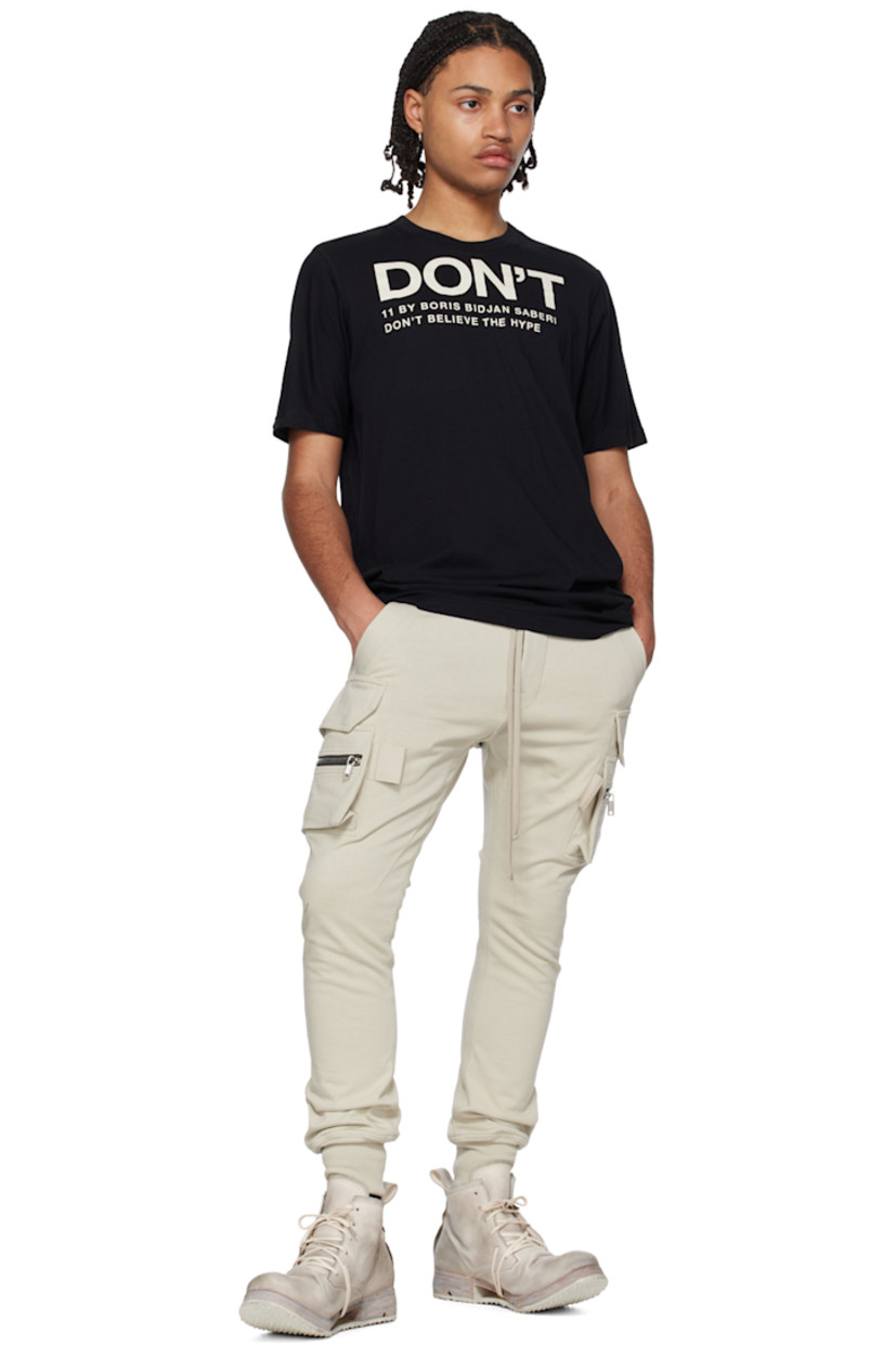 Garment-dyed cotton jersey T-shirt. 

· Rib knit crewneck
· Logo and text printed at front and back collar
· Drawstring at back collar 
· Offset seam at back

Each item is unique. Please note that coloration may vary.

Supplier color: Black dye