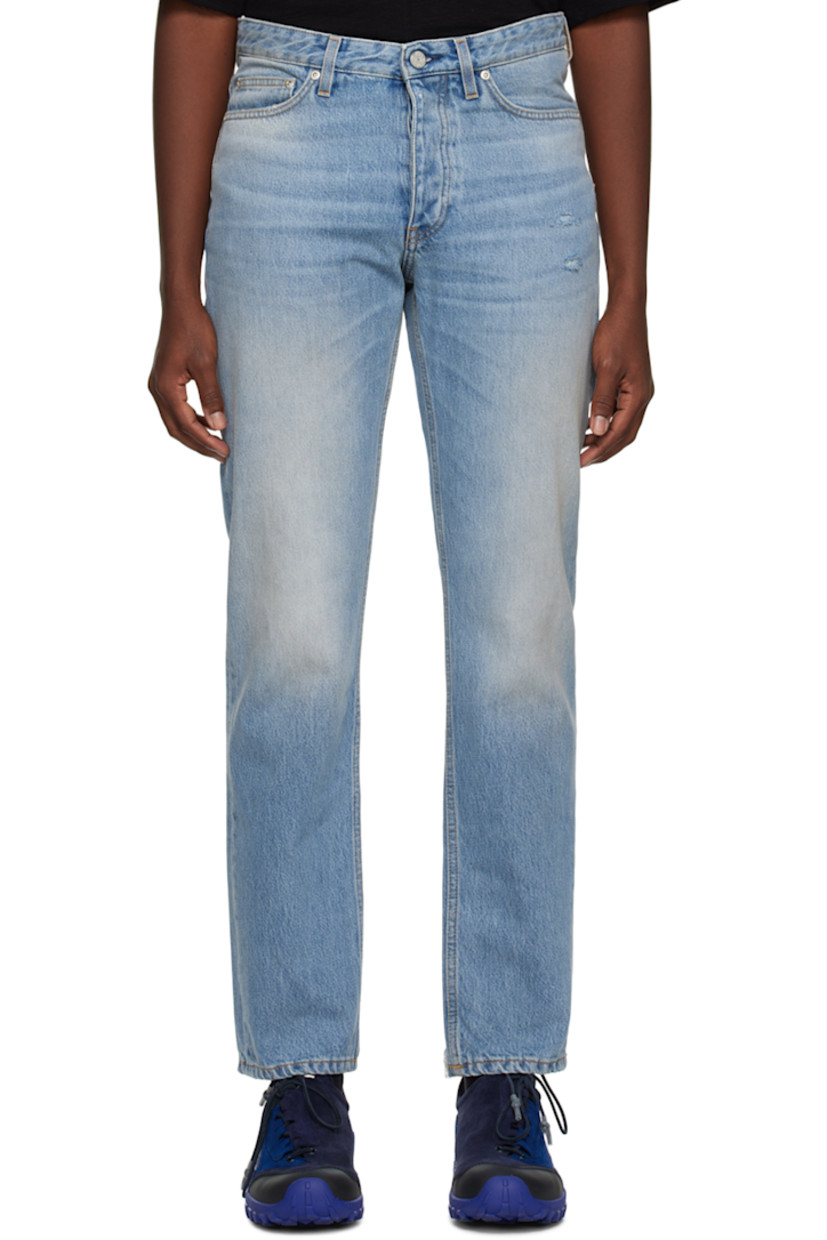 Slim-fit non-stretch denim jeans. Distressing, fading, and whiskering throughout.

· Belt loops
· Five-pocket styling
· Button-fly
· Leather logo patch at back waistband
· Darts at back pockets
· Logo-engraved silver-tone hardware
· Contrast stitching in tan

Supplier color: Worn blue 8