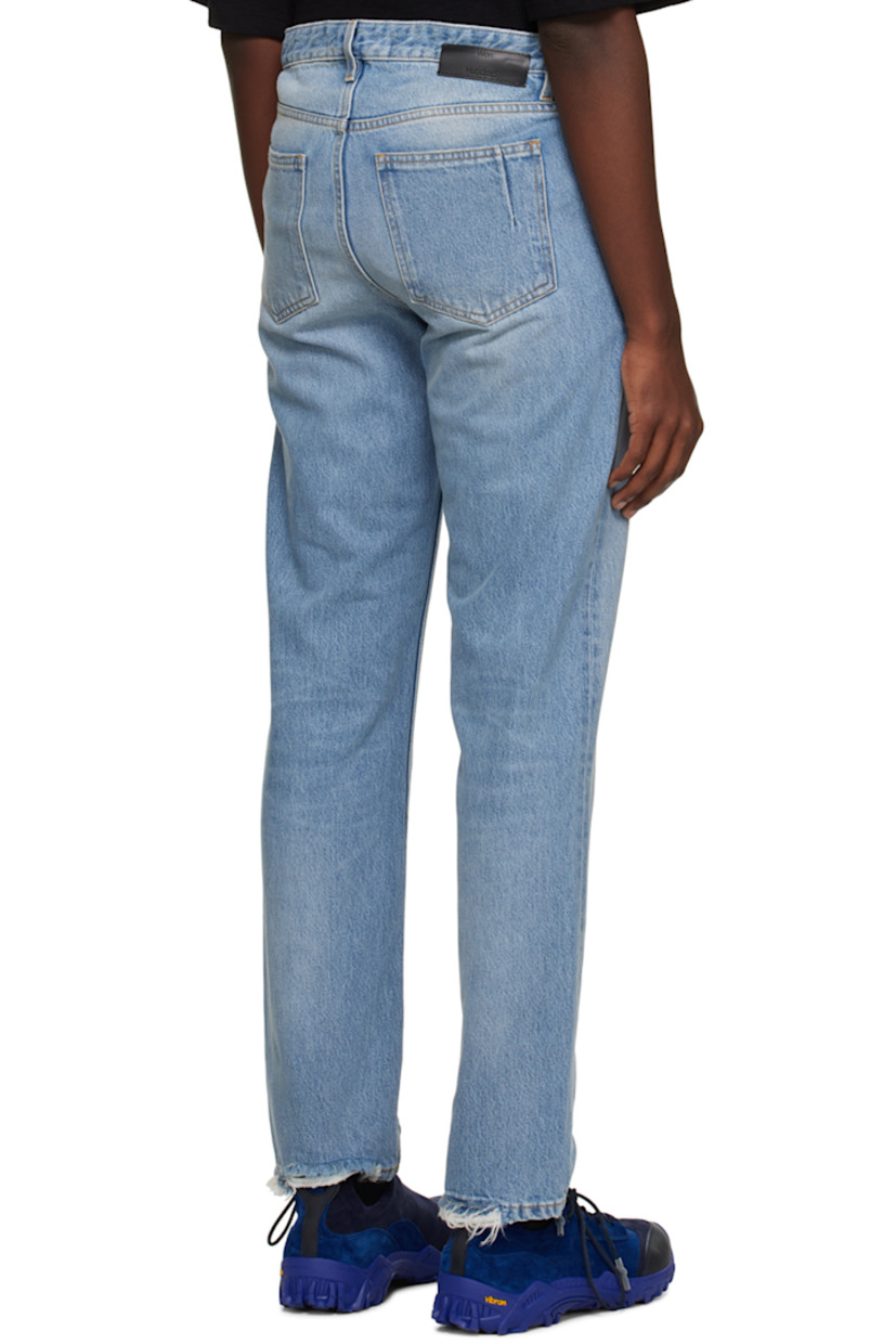 Slim-fit non-stretch denim jeans. Distressing, fading, and whiskering throughout.

· Belt loops
· Five-pocket styling
· Button-fly
· Leather logo patch at back waistband
· Darts at back pockets
· Logo-engraved silver-tone hardware
· Contrast stitching in tan

Supplier color: Worn blue 8