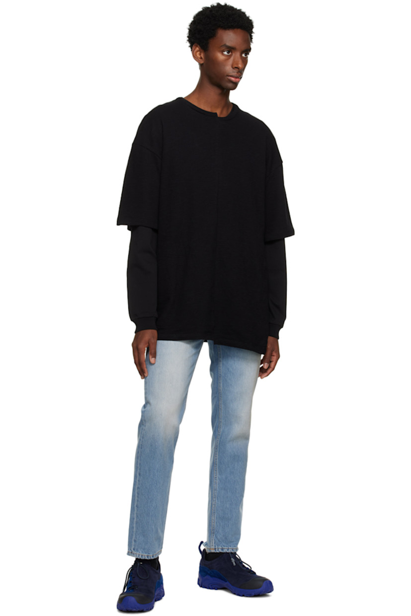 Slim-fit non-stretch denim jeans. Distressing, fading, and whiskering throughout.

· Belt loops
· Five-pocket styling
· Button-fly
· Leather logo patch at back waistband
· Darts at back pockets
· Logo-engraved silver-tone hardware
· Contrast stitching in tan

Supplier color: Worn blue 8