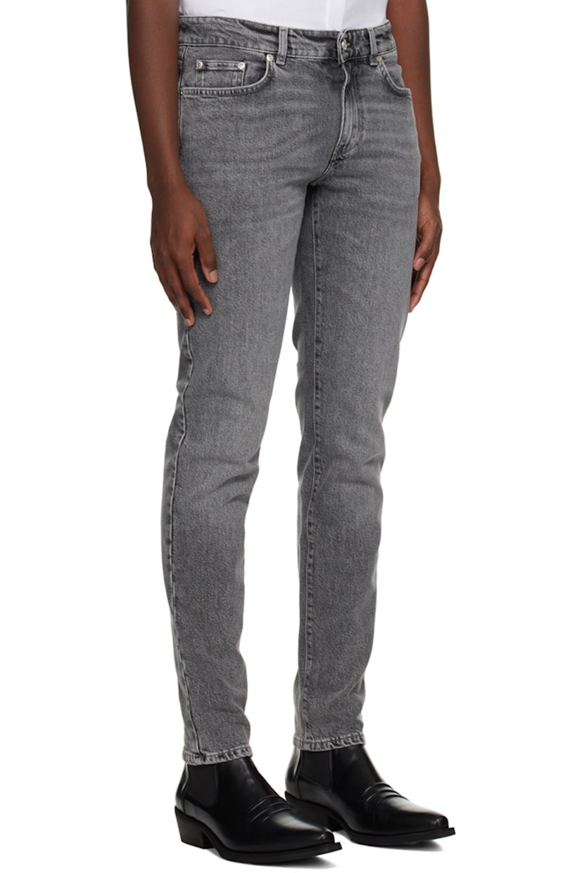 Organic cotton stretch denim jeans.

· Belt loops
· Five-pocket styling
· Zip-fly
· Leather logo patch at back waistband
· Darts at back pockets
· Logo-engraved silver-tone hardware

Supplier color: Saint gray