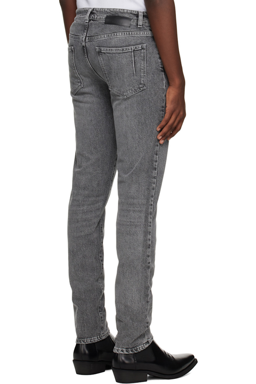 Organic cotton stretch denim jeans.

· Belt loops
· Five-pocket styling
· Zip-fly
· Leather logo patch at back waistband
· Darts at back pockets
· Logo-engraved silver-tone hardware

Supplier color: Saint gray