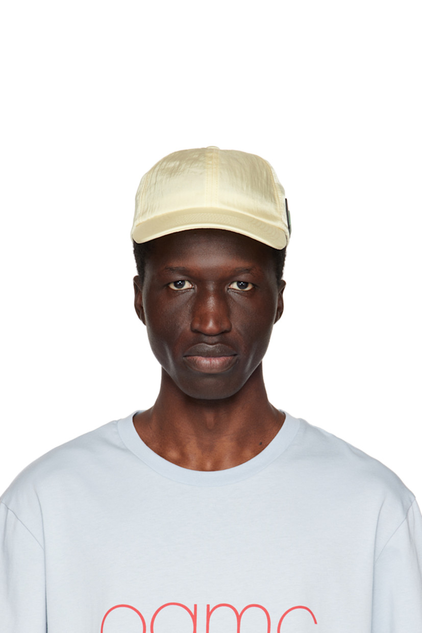 Nylon twill cap.

· Curved brim
· Rubberized logo patch at side
· Press-stud fastening at back face

Supplier color: Sunshine