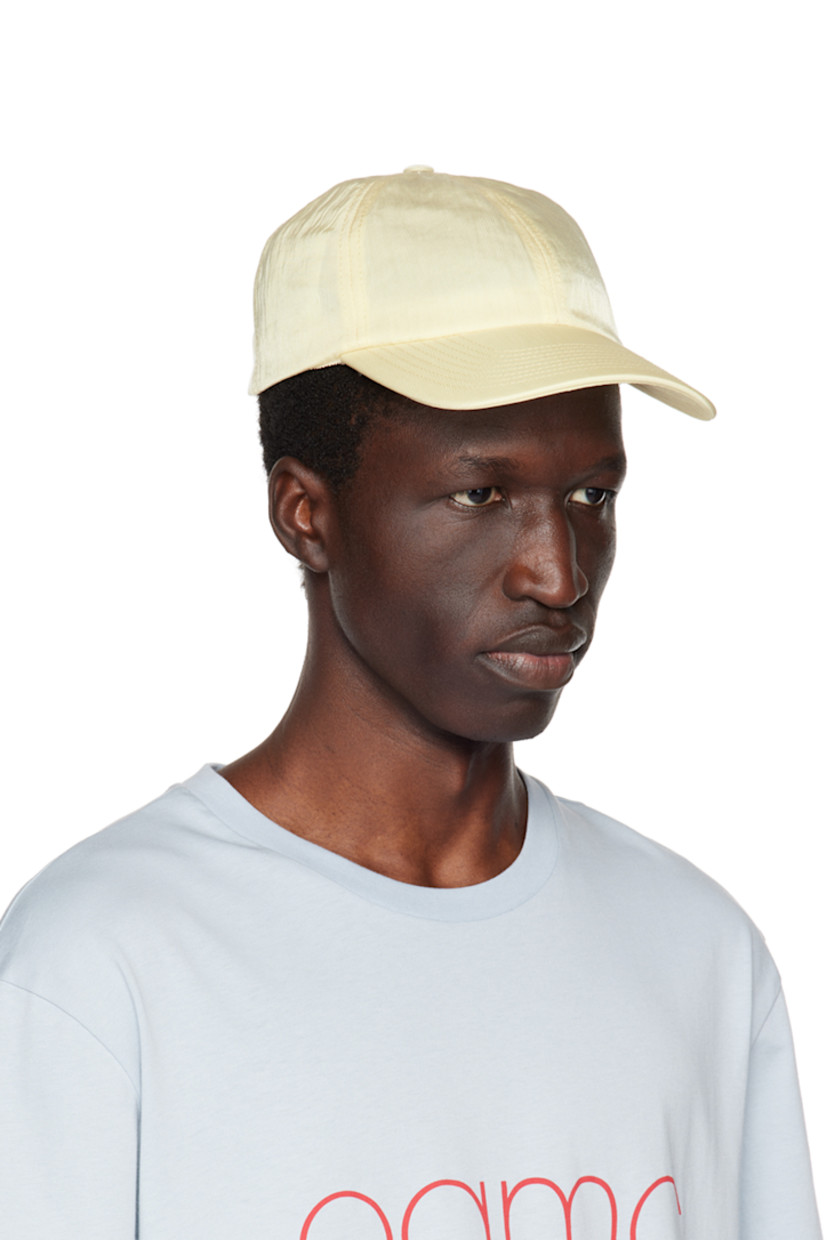 Nylon twill cap.

· Curved brim
· Rubberized logo patch at side
· Press-stud fastening at back face

Supplier color: Sunshine