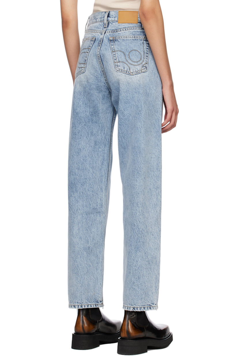 Non-stretch denim jeans. Fading and subtle distressing throughout. 

· Belt loops 
· Five-pocket styling 
· Button-fly 
· Logo patch at coin pocket 
· Rubberized logo patch at back waistband
· Logo graphic embroidered at back pocket
· Contrast stitching in beige 

Supplier color: Light stone