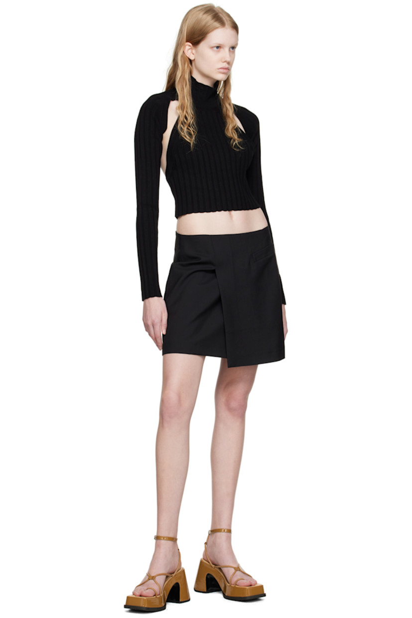 Wool piqué skirt. 

· Layered construction
· Welt pocket at front
· Slit at front hem
· Logo flag at side seam
· Concealed zip closure at back
· Full viscose satin lining

Supplier color: Coal