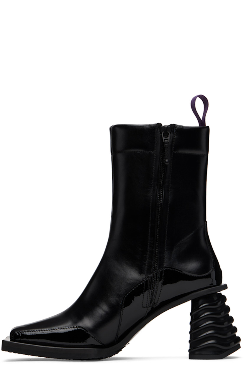Ankle-high paneled buffed leather and patent leather boots in black. Rubberized logo patch at outer side.

· Square toe
· Webbing pull-loop at padded heel collar
· Zip closure at inner side
· Grained leather lining
· Rubber midsole and block heel
· Treaded rubber outsole
· Heel: H3 in

Supplier color: Black