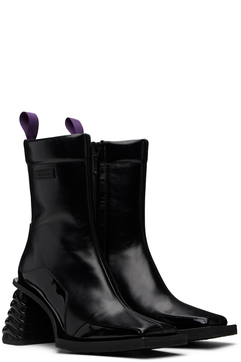 Ankle-high paneled buffed leather and patent leather boots in black. Rubberized logo patch at outer side.

· Square toe
· Webbing pull-loop at padded heel collar
· Zip closure at inner side
· Grained leather lining
· Rubber midsole and block heel
·� Treaded rubber outsole
· Heel: H3 in

Supplier color: Black