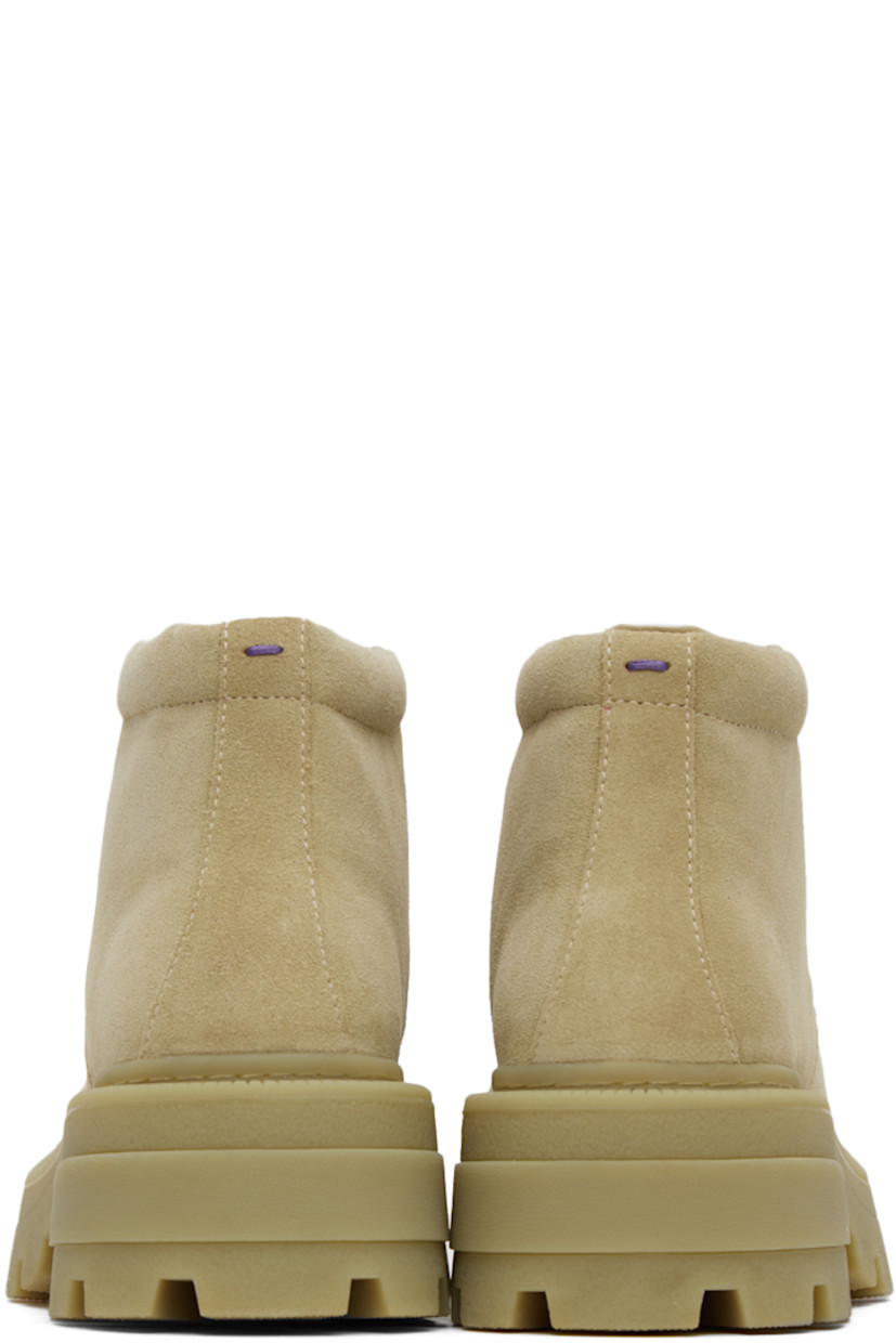 Ankle-high nubuck boots in beige.

· Square moc toe
· Lace-up closure
· Rubberized logo patch at tongue
· Padded collar
· Buffed leather lining
· Textured rubber platform midsole
· Treaded rubber outsole
· Heel: H2.25 in
· Platform: H1.25 in

Supplier color: Gobi