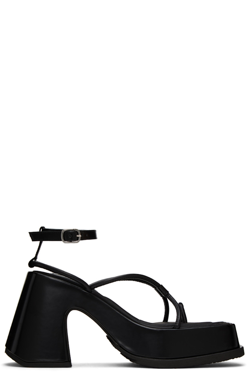 Handcrafted polished leather heeled sandals in black.

· Open square toe
· Criss-crossing straps at vamp
· Adjustable pin-buckle ankle strap
· Logo patch at padded calfskin footbed
· Covered platform midsole and block heel
· Treaded rubber outsole
· Platform: H1.5 in
· Heel: H4 in

Supplier color: Black