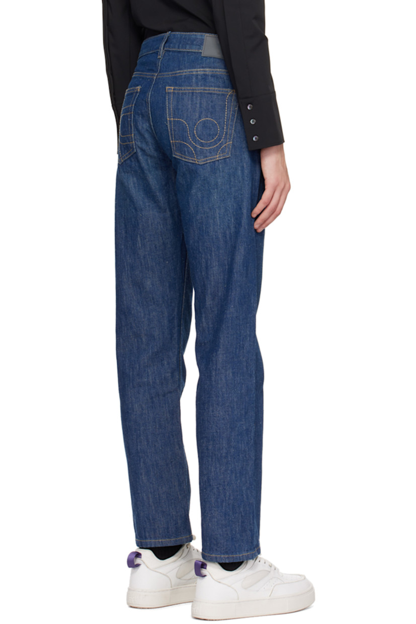 Non-stretch denim jeans.

· Belt loops
· Five-pocket styling
· Button-fly
· Rubberized logo patch at back waistband
· Logo graphic embroidered at back
· Contrast stitching in tan

Supplier color: Crude