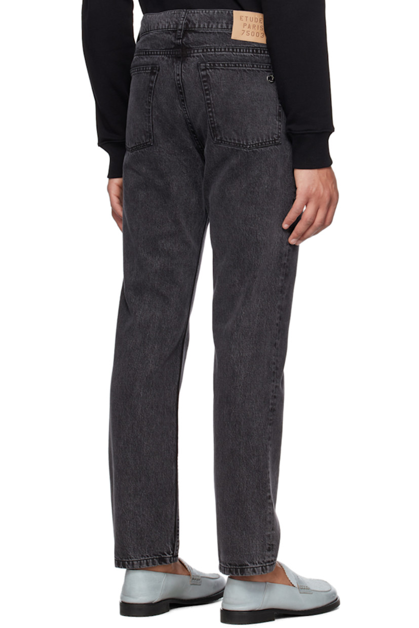 Slim-fit non-stretch organic denim jeans. Fading throughout.

· Mid-rise
· Belt loops
· O-ring hardware at front
· Five-pocket styling
· Zip-fly
· Leather logo patch at waistband

Supplier color: Black