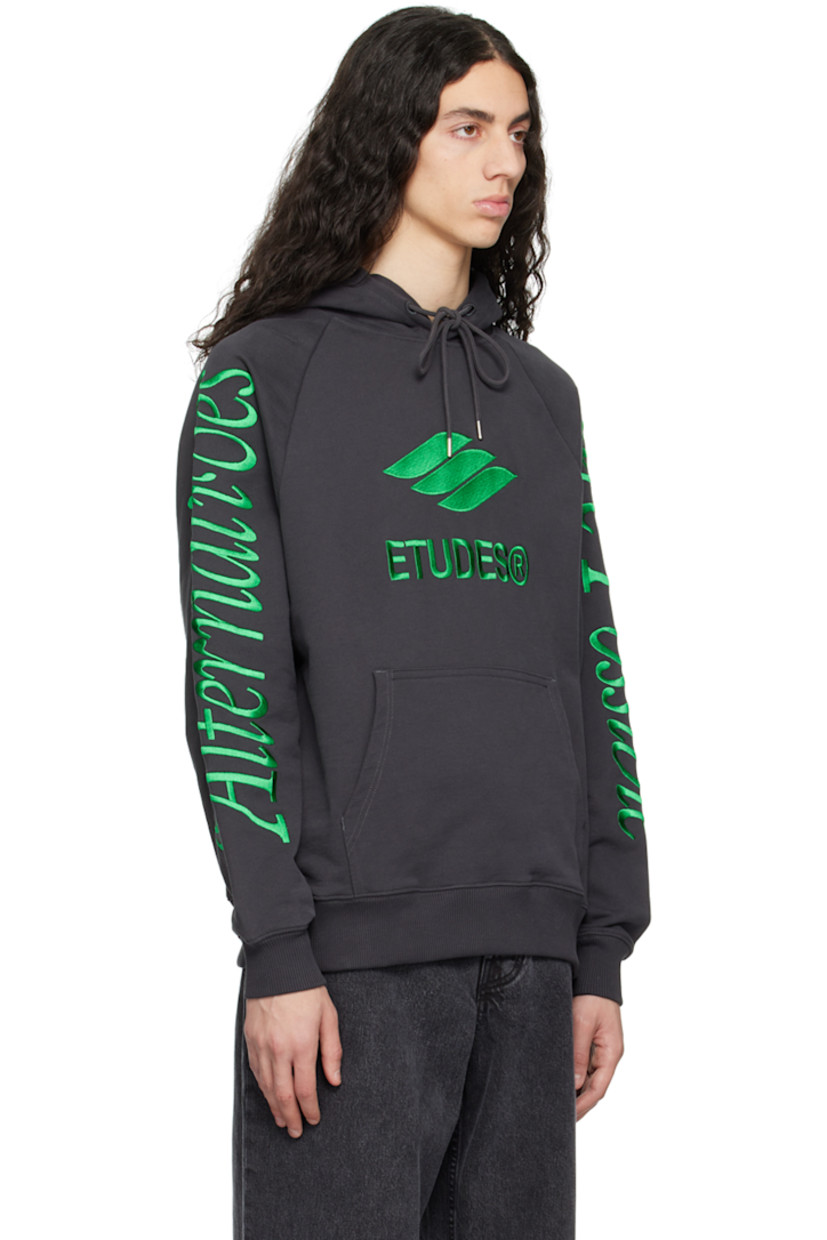 Organic cotton French terry hoodie. 

· Drawstring at hood
· Logo graphic embroidered at front
· Kangaroo pocket
· Rib knit hem and cuffs
· Text embroidered at raglan sleeves

Supplier color: Black