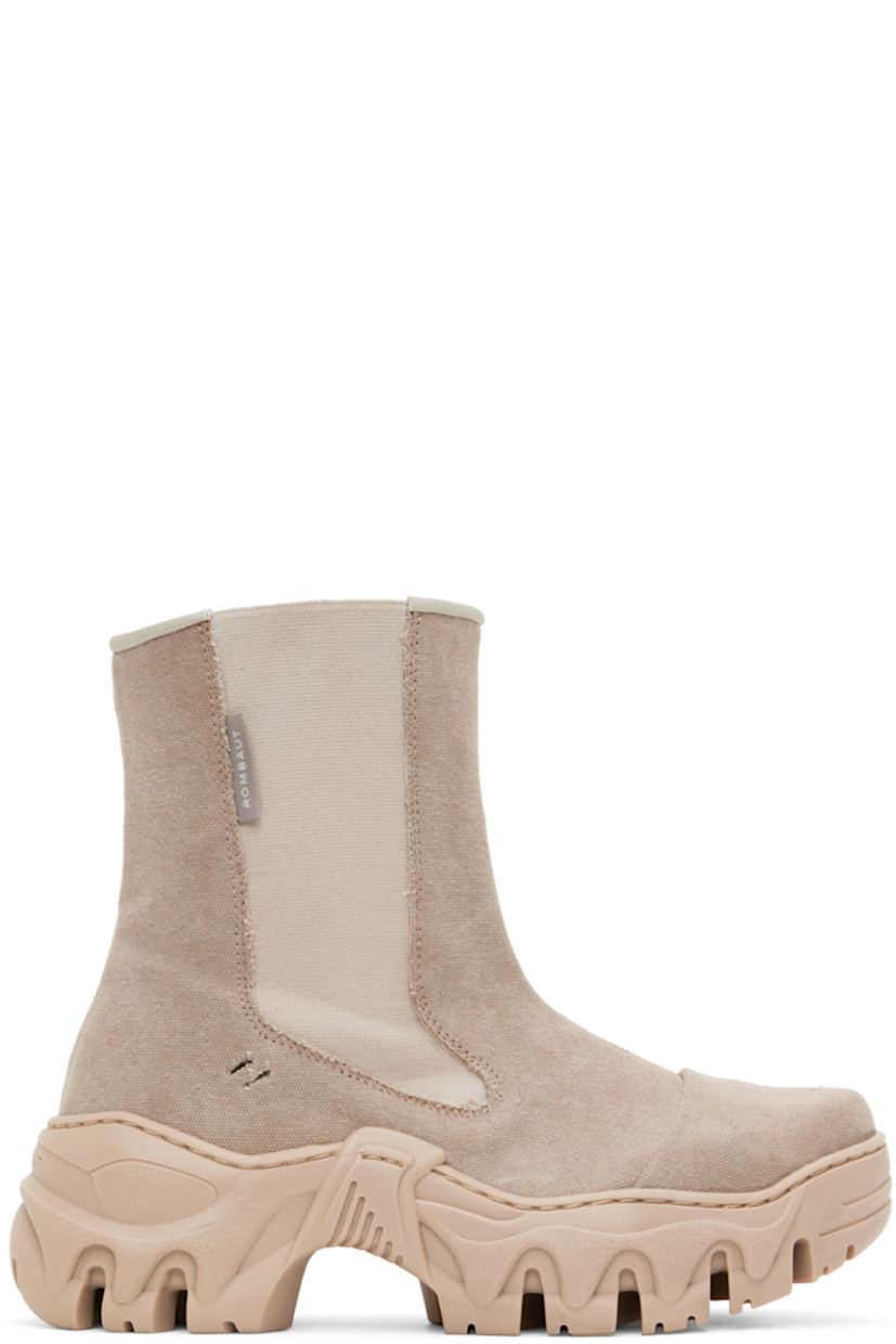 Handcrafted ankle-high recycled canvas boots in tan.

· Cap toe
· Elasticized gusset at sides
· Textile logo flag at outer side
· Faux-leather lining
· Sculptural rubber platform midsole
· Treaded rubber outsole
· Platform: H2 in

Supplier color: Recycled desert