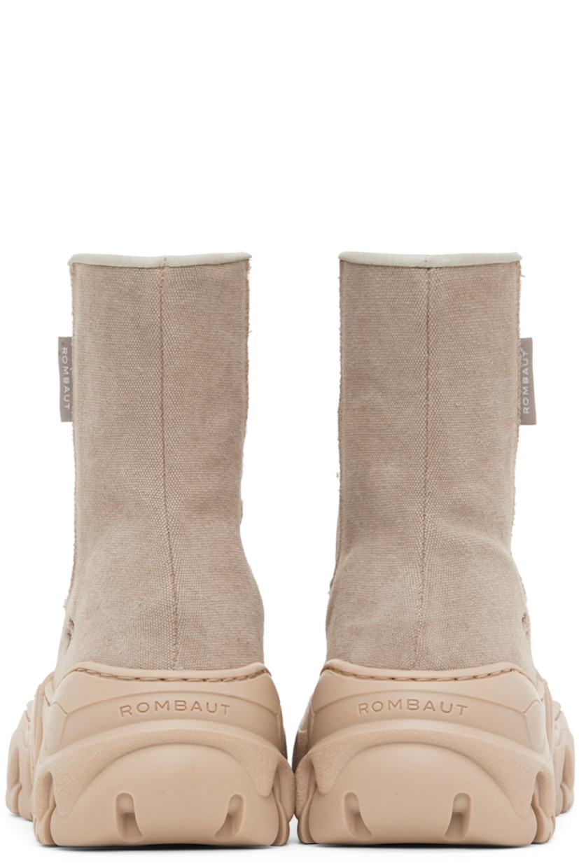 Handcrafted ankle-high recycled canvas boots in tan.

· Cap toe
· Elasticized gusset at sides
· Textile logo flag at outer side
· Faux-leather lining
· Sculptural rubber platform midsole
· Treaded rubber outsole
· Platform: H2 in

Supplier color: Recycled desert