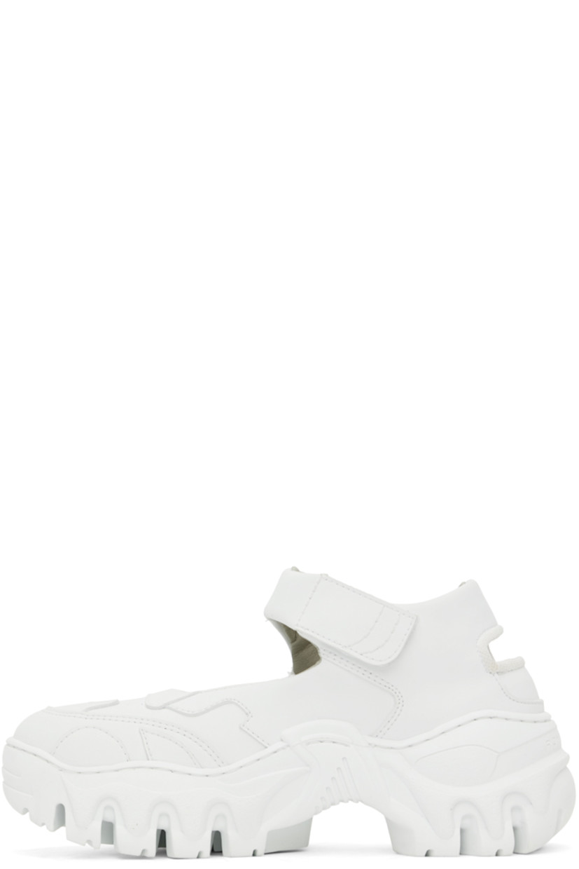 Handcrafted high-top grained faux-leather sneakers in white. Cutouts throughout.

· Paneled construction
· Velcro ankle strap
· Textile logo flag at outer side
· Logo engraved at heel counter
· Mesh lining
· Sculptural rubber platform midsole
· Treaded rubber outsole
· Platform: H2 in

Supplier color: White