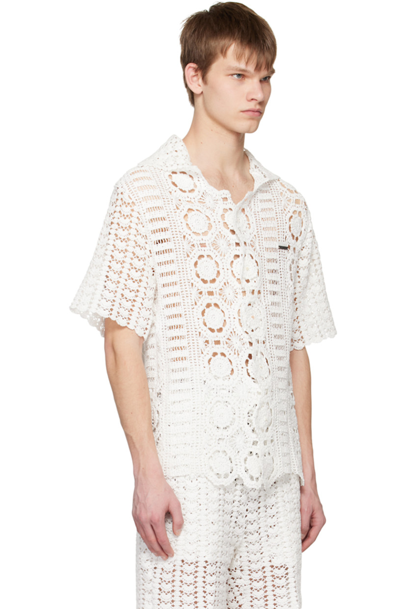 Handcrafted crocheted cotton shirt. Scalloped edges throughout. 

· Open spread collar
· Button closure
· Embroidered and embellished logo plaque
· Shell hardware

Supplier color: White