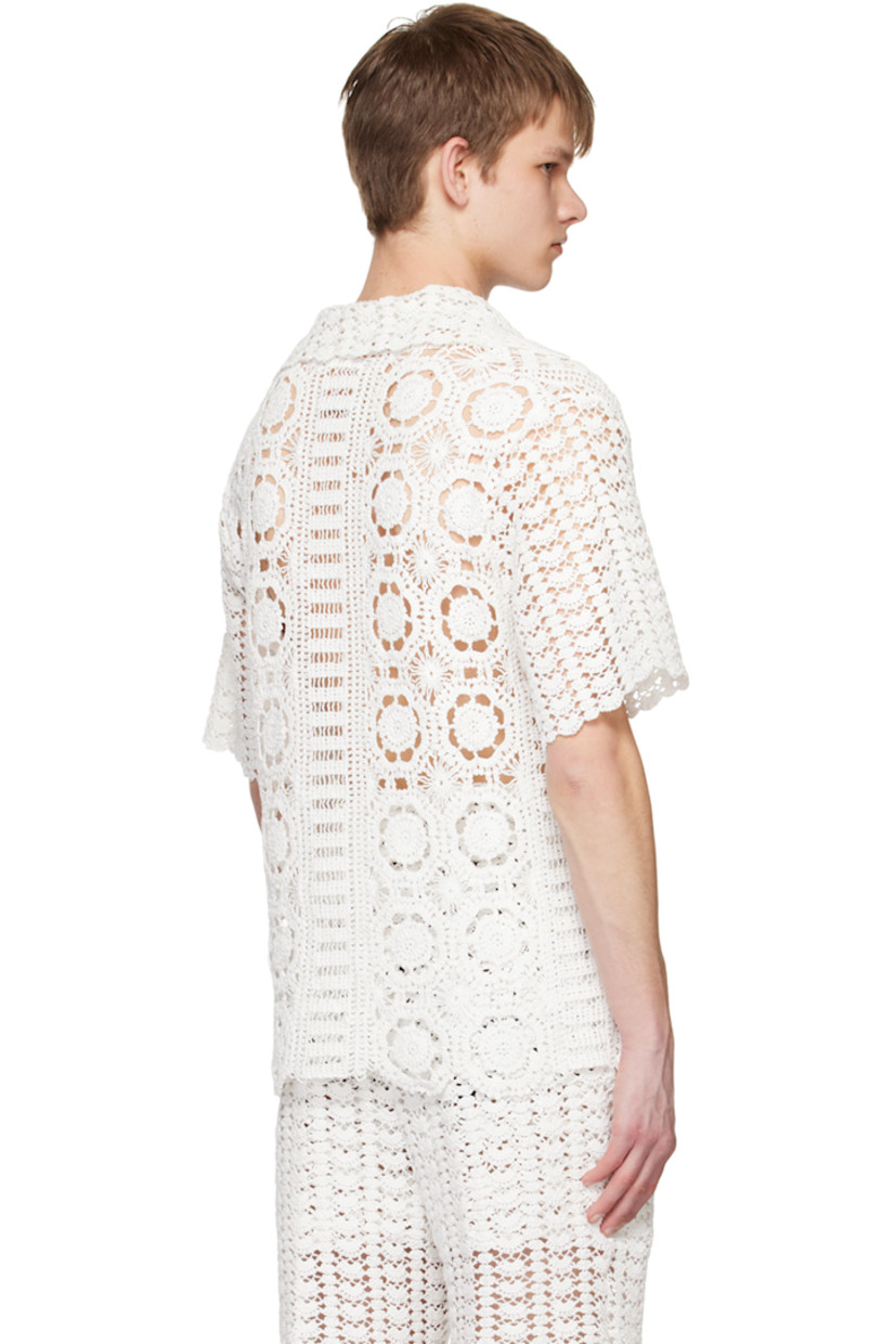 Handcrafted crocheted cotton shirt. Scalloped edges throughout. 

· Open spread collar
· Button closure
· Embroidered and embellished logo plaque
· Shell hardware

Supplier color: White