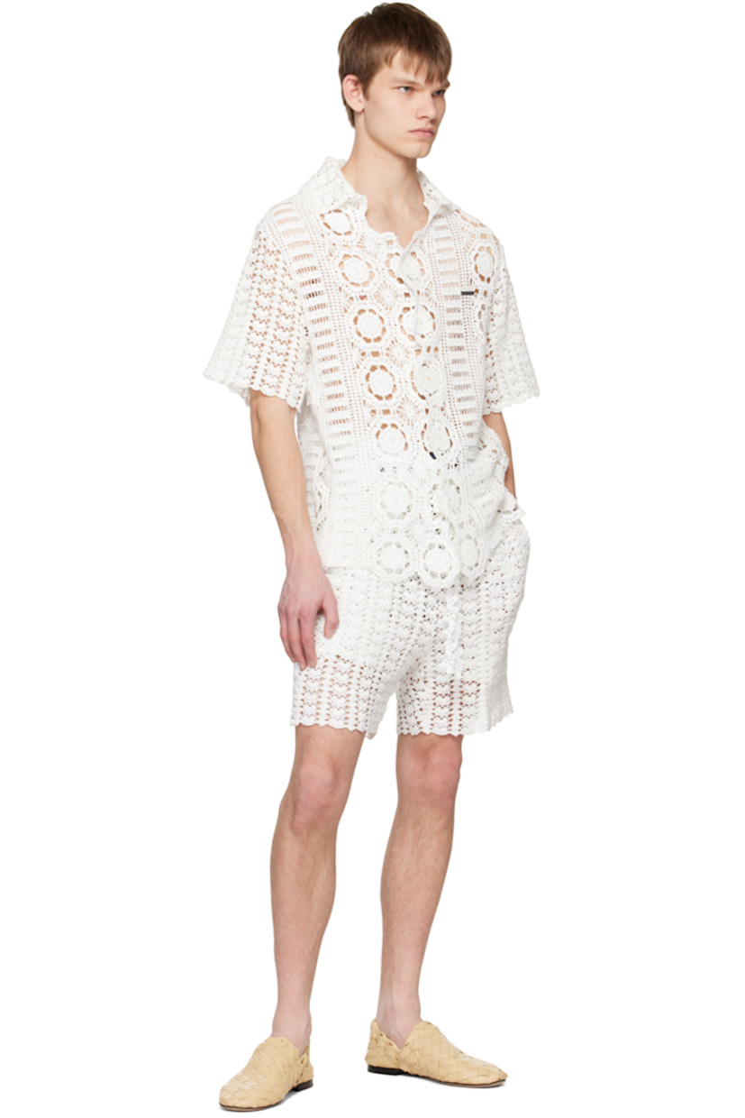 Handcrafted crocheted cotton shirt. Scalloped edges throughout. 

· Open spread collar
· Button closure
· Embroidered and embellished logo plaque
· Shell hardware

Supplier color: White