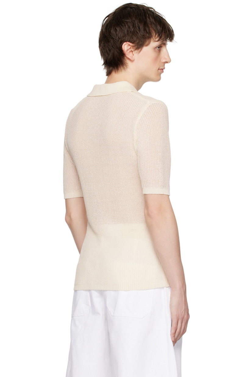 Semi-sheer rib knit rayon-blend polo.

· Spread collar
· Three-button placket
· Mother-of-pearl hardware

Supplier color: Cream