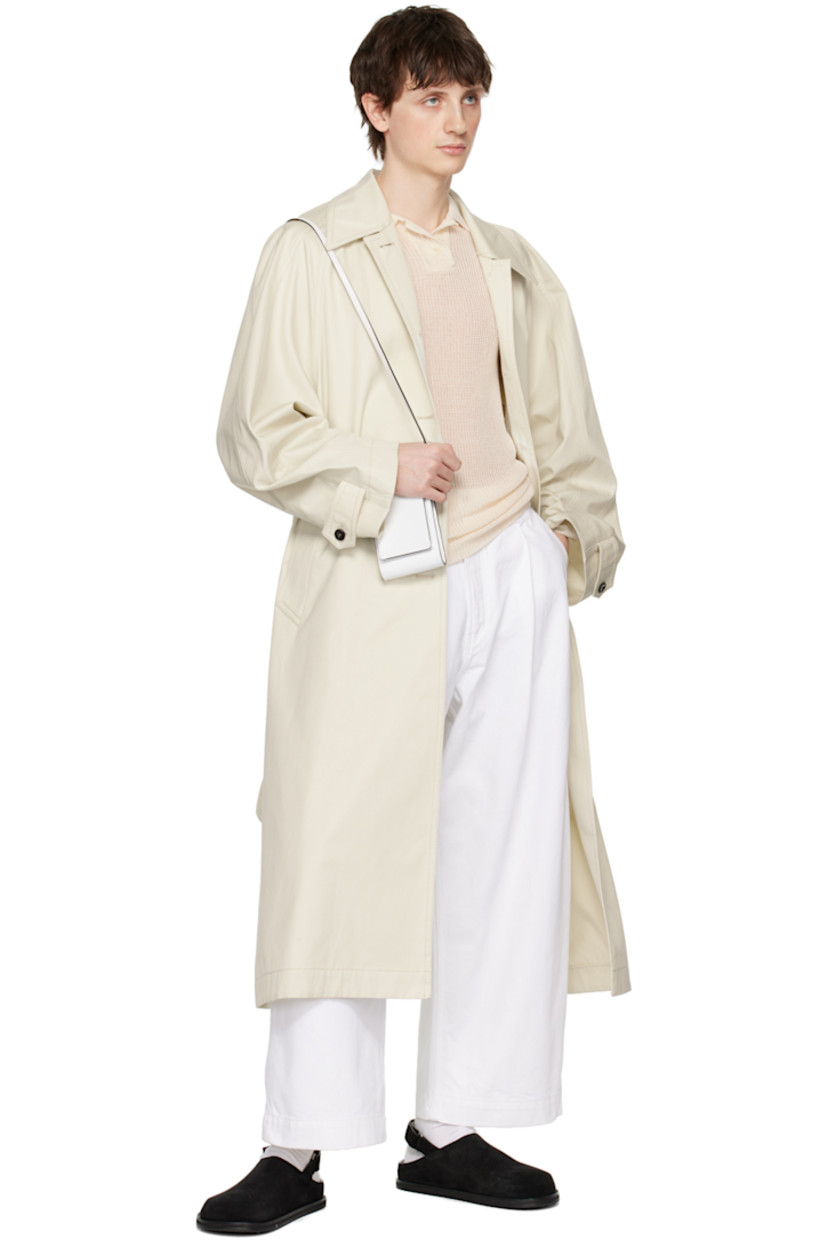 Semi-sheer rib knit rayon-blend polo.

· Spread collar
· Three-button placket
· Mother-of-pearl hardware

Supplier color: Cream