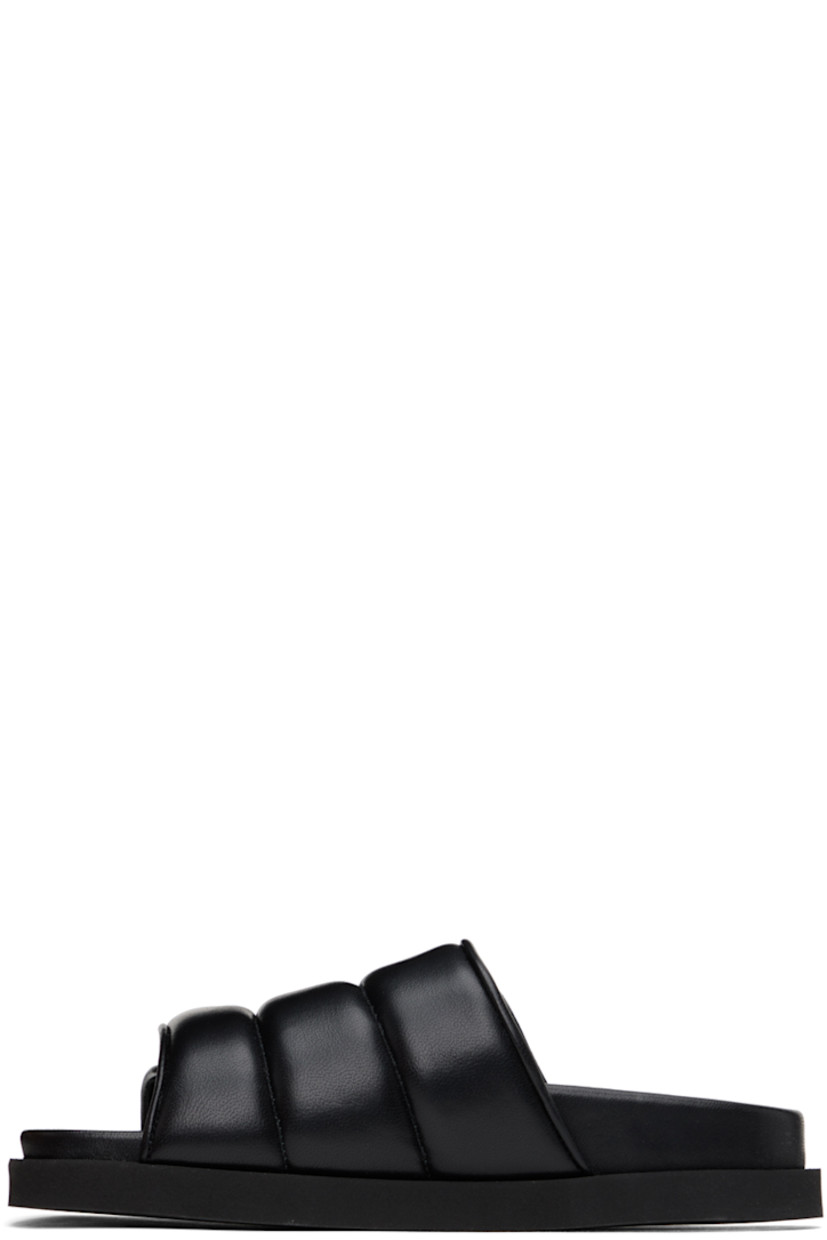 Padded quilted grained leather slip-on sandals in black.

· Open round toe
· Velcro strap at vamp
· Grained leather lining
· Logo embossed at molded footbed
· Foam rubber sole

Supplier color: Black