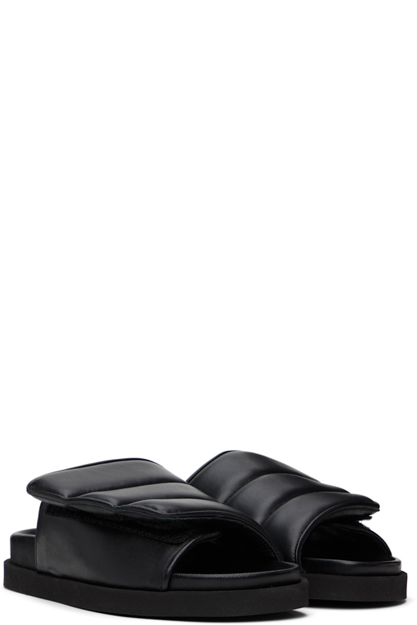 Padded quilted grained leather slip-on sandals in black.

· Open round toe
· Velcro strap at vamp
· Grained leather lining
· Logo embossed at molded footbed
· Foam rubber sole

Supplier color: Black