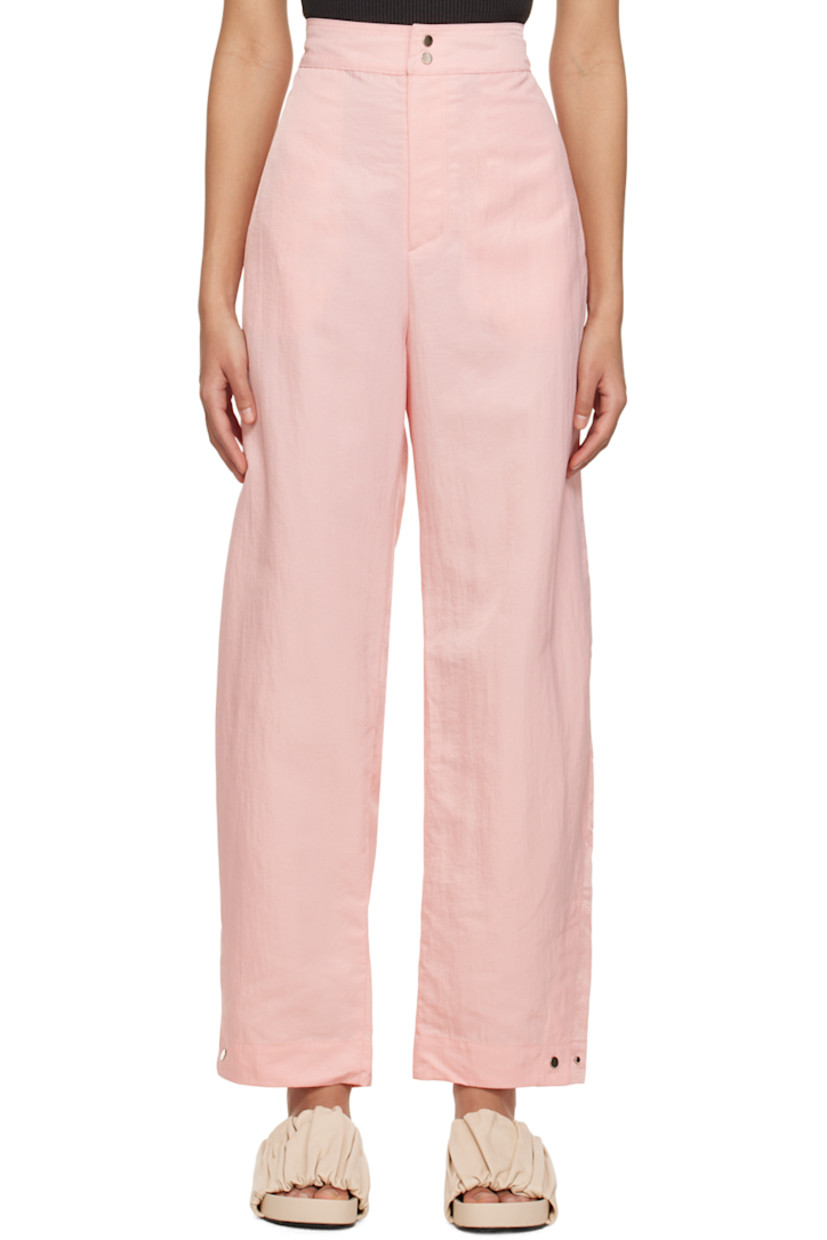 Wide-leg crinkled nylon taffeta trousers. Water-repellent, stain-resistant, and wrinkle-resistant. 

· Partially elasticized waistband
· Four-pocket styling
· Zip-fly
· Press-stud vent at cuffs 

Supplier color: Baby pink